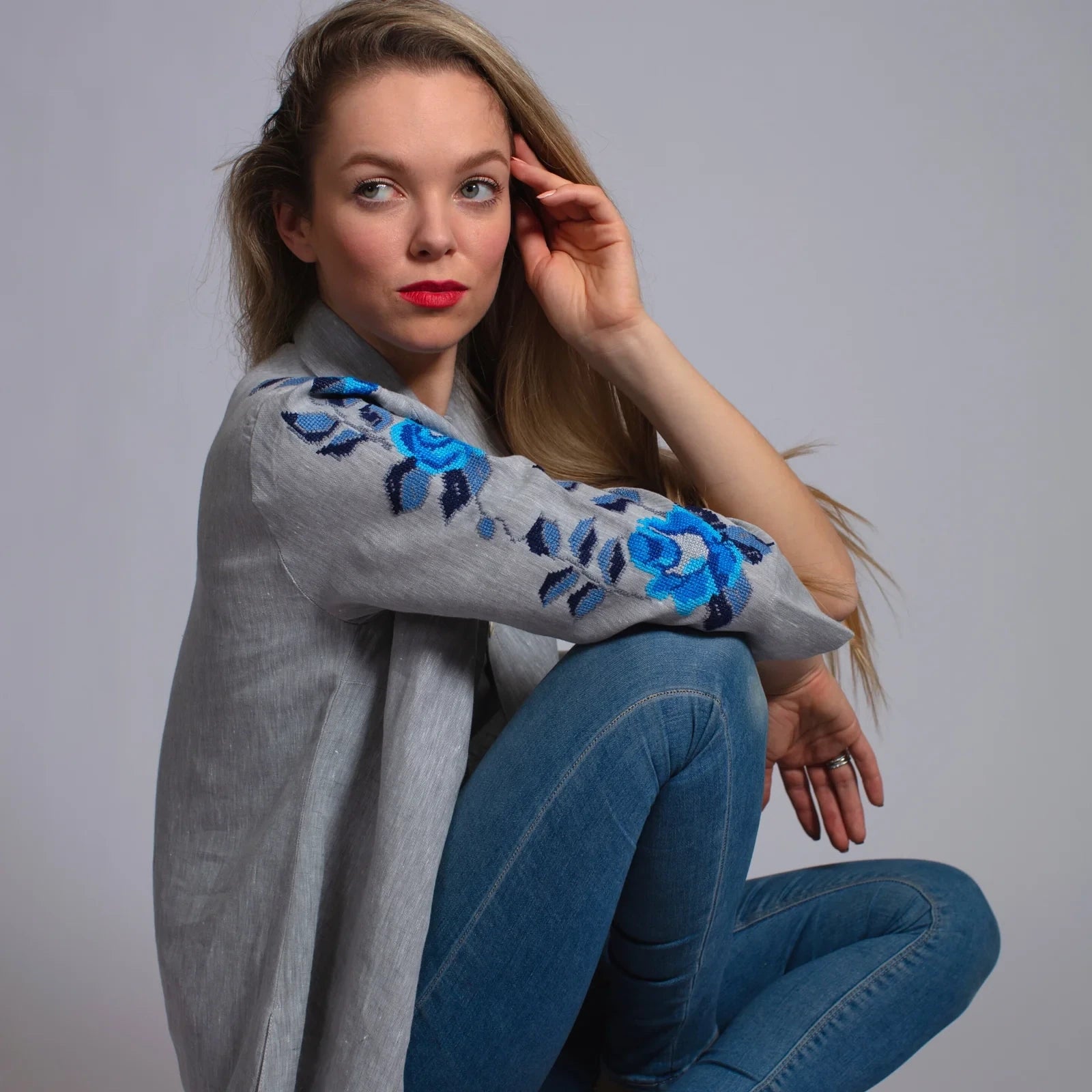 Grey linen shirt featuring intricate hand embroidery, combining comfort and elegance.