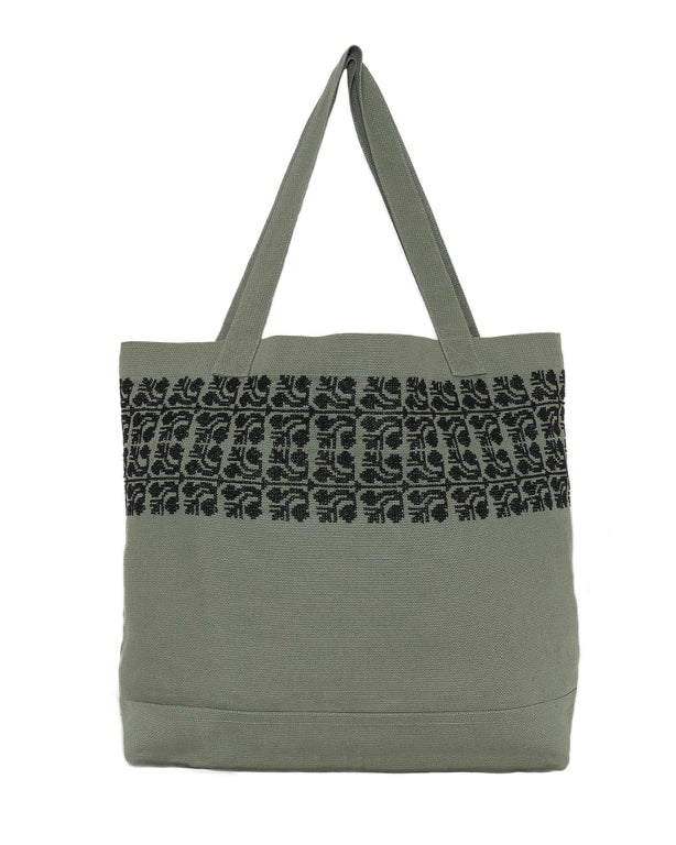 Khaki canvas tote bag with black embroidered Sinead® pattern and button-close pocket