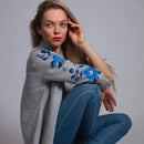 Grey linen shirt featuring intricate hand embroidery, combining comfort and elegance.