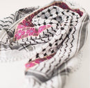 Folded fabric with geometric patterns on a white background