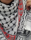 Keffiyeh Makatib with hand-embroidered detailing, symbolizing messages of hope and resilience.