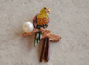 Handcrafted brooches made with ethical materials and artisan embroidery
