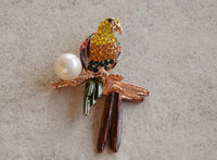 Handcrafted brooches made with ethical materials and artisan embroidery